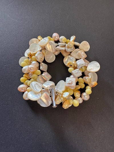 Multi-stranded pastel-hued pearl and gemstone bracelet