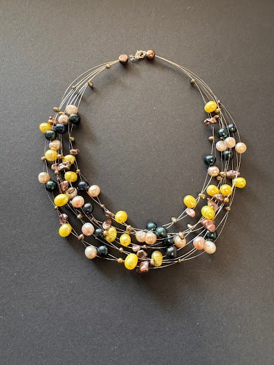Multi-stranded yellow pearl necklace
