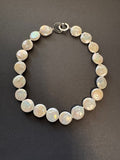 White coin pearl necklace with a puzzle clasp