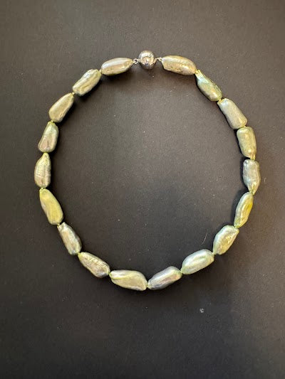 Pale olive green-hued elongated pearl necklace