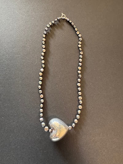 Large silver heart and peacock-hued pearl necklace