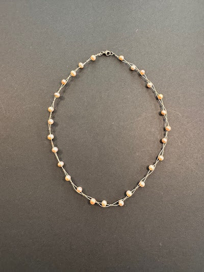 Soft-pink-hued pearl twisted strand necklace