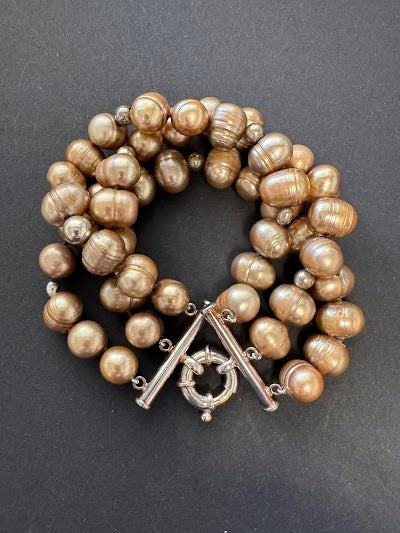 Multi-stranded golden-bronze-hued pearl bracelet
