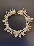 Double-stranded white stick and pastel-hued pearl necklace