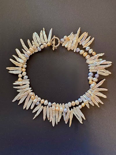 Double-stranded white stick and pastel-hued pearl necklace