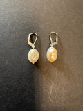 Creamy-white-hued pearl earrings