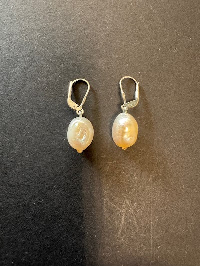 Creamy-white-hued pearl earrings