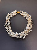 Double-stranded white 'clustered' baroque pearl necklace with an amber box clasp