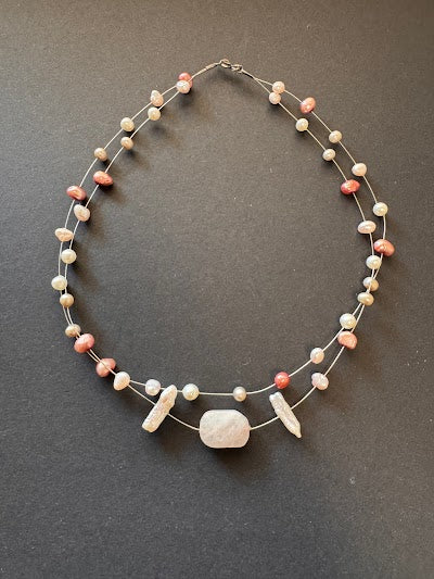 Freshwater pearl 'floating' necklace with a polished rose quartz stone