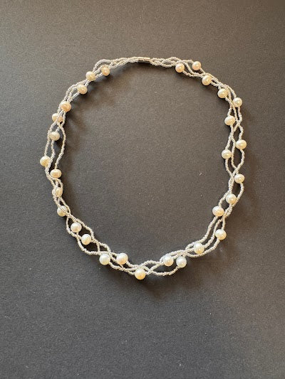 Multi-stranded white pearl and bead necklace