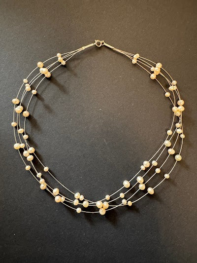 Multi-stranded white pearl necklace