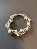 Multi-stranded white pearl and bead bracelet