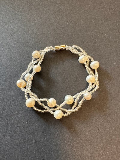 Multi-stranded white pearl and bead bracelet