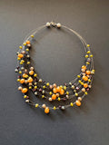 Multi-stranded orange pearl necklace