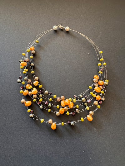 Multi-stranded orange pearl necklace