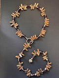 Bronze-hued stick and round pearl lariat necklace