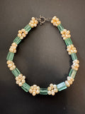 Clustered cream-hued pearl and green glass bead necklace