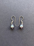 Peacock-hued oval pearl earrings