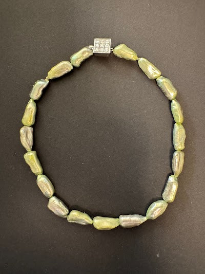Pale olive green-hued elongated pearl necklace with box clasp