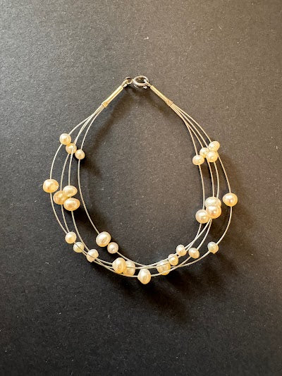Multi-stranded white pearl bracelet