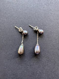 Peacock-hued teardrop pearl earrings on a pearl and sterling silver post