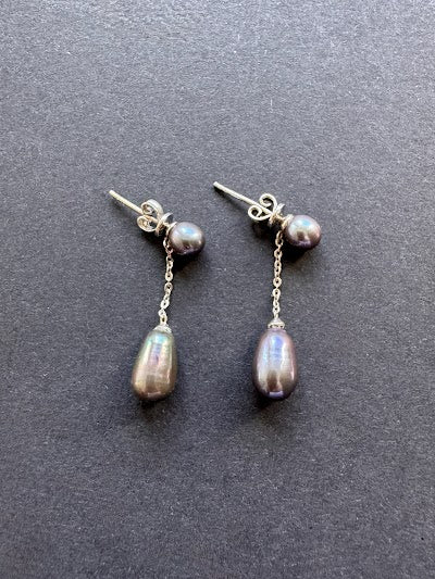 Peacock-hued teardrop pearl earrings on a pearl and sterling silver post