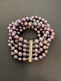 Multi-stranded purple-hued pearl bracelet