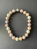 White, pink, mauve and peach-hued (17-18mm) shell pearl necklace
