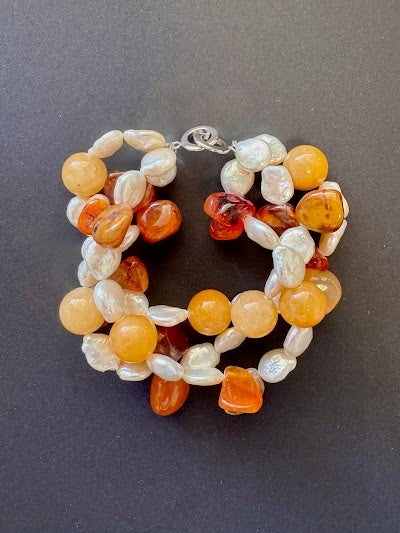 Double-stranded white pearl and orange gemstone bracelet