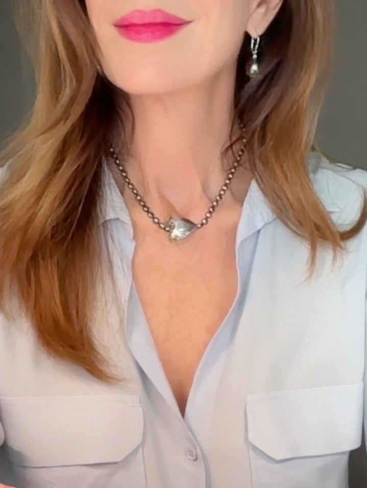 Large silver heart and peacock-hued pearl necklace