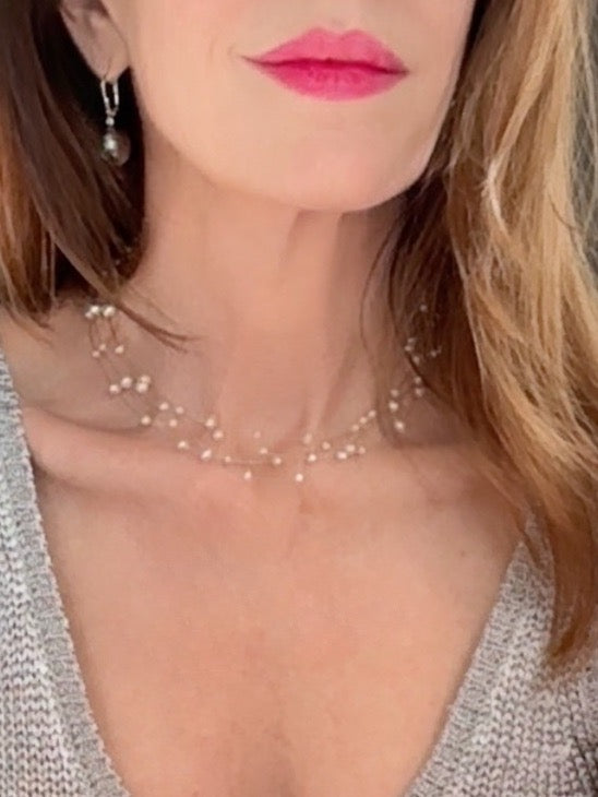 Multi-stranded white pearl necklace