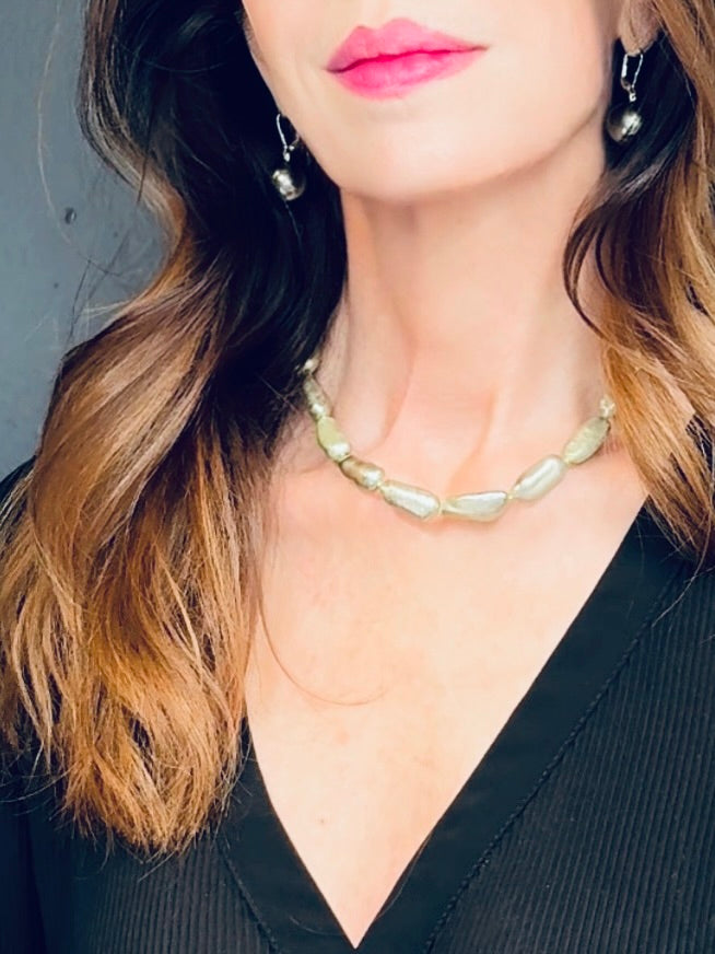 Pale olive green-hued elongated pearl necklace
