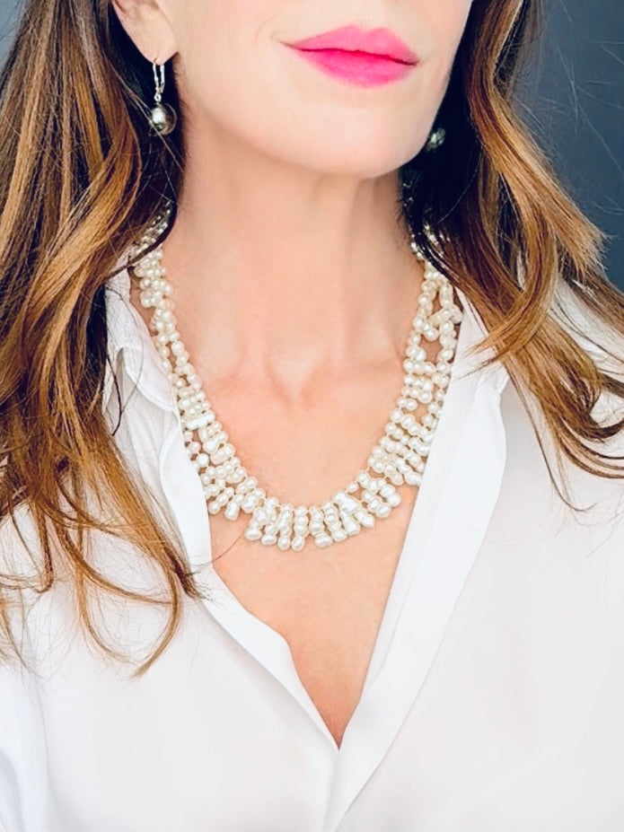 Double-stranded white 'clustered' baroque pearl necklace with an amber box clasp