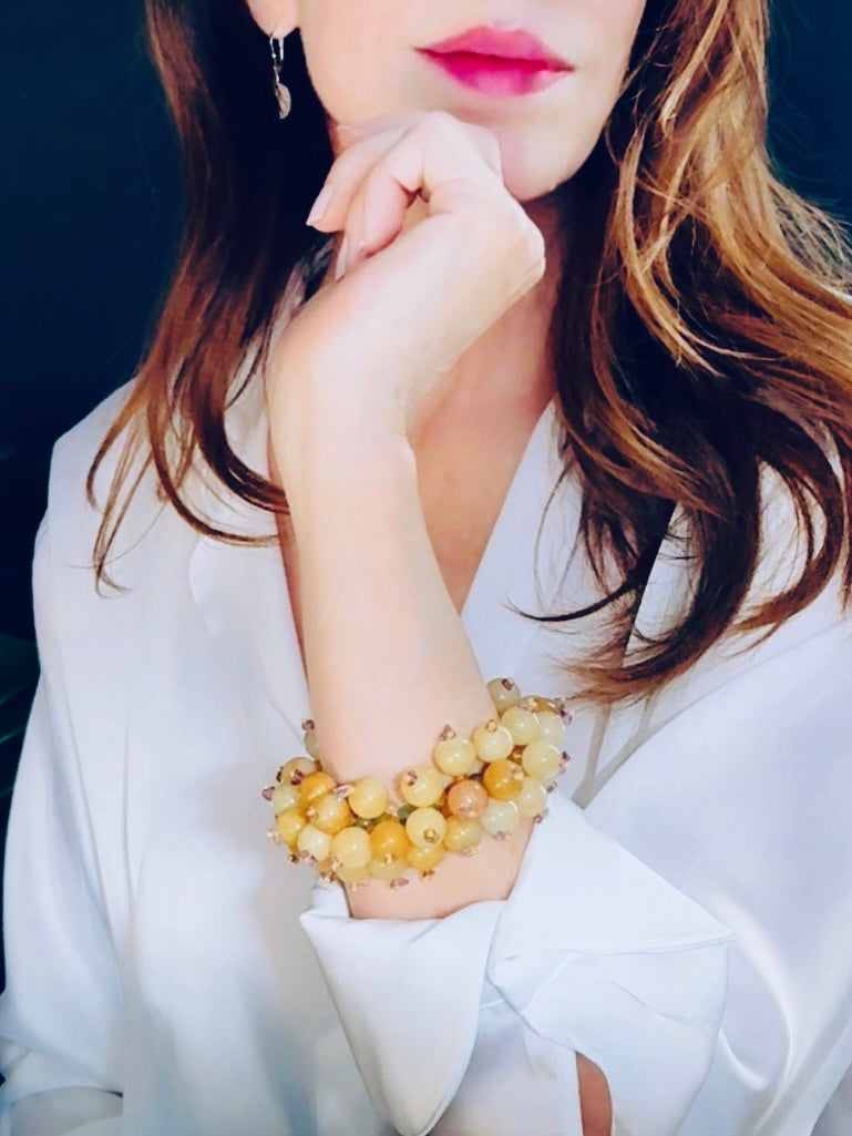 Polished light orange and mustard-hued jade stretch bracelet