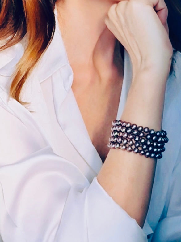 Multi-stranded purple-hued pearl bracelet